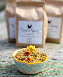 Scent of Spring Nesting Herbs For Backyard Chickens in a bowl with bags in background